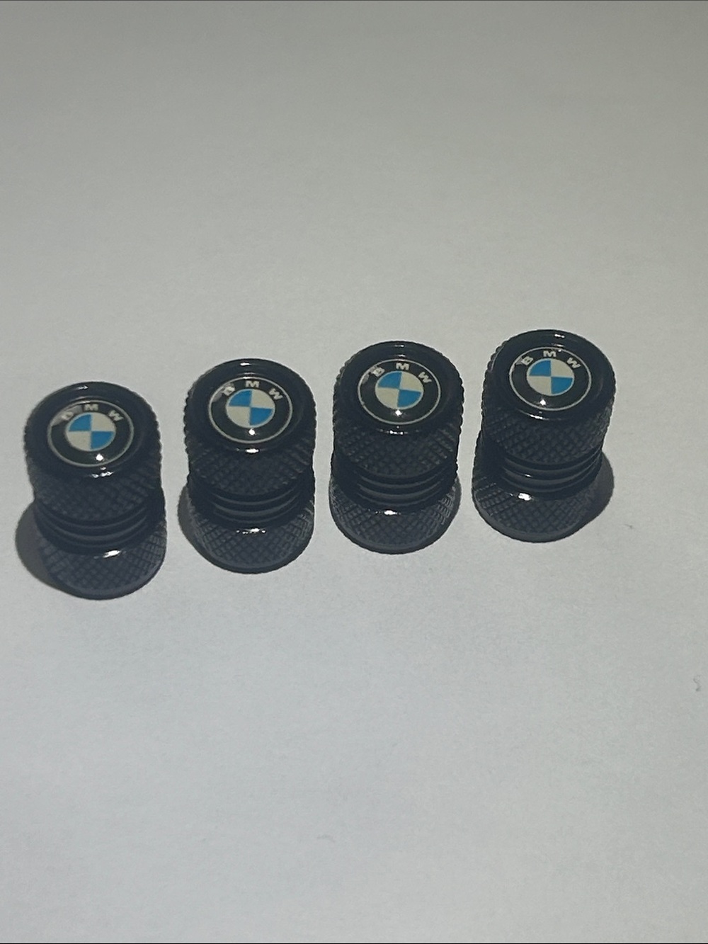 BMW Black Valve Stem Caps with Blue and White Emblems (Set of 4)